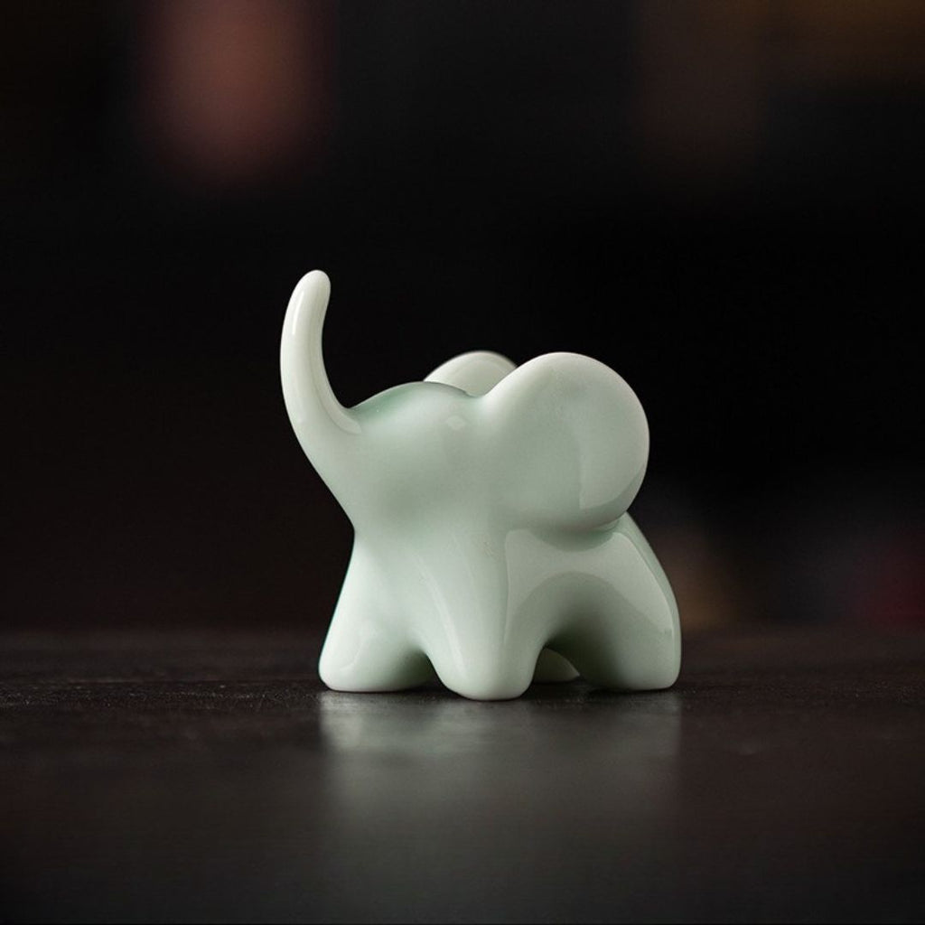 Ceramic Upturned Trunk Elephant Figurine